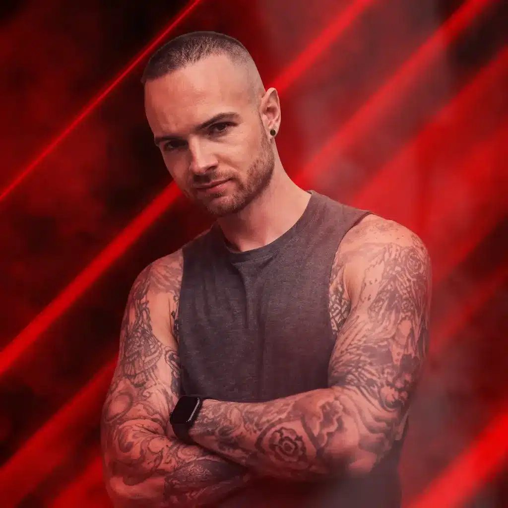 DJ Connor Bladon promotional image for Arch Clapham, showing Connor with folded arms against a smoky red nightclub-style background.