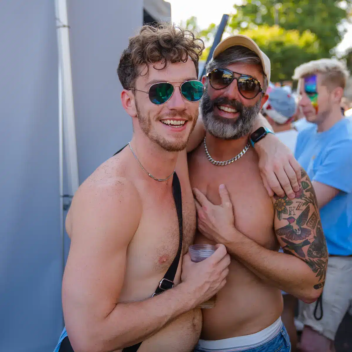 Crowds celebrating Clapham Pride at Arch Clapham street party with drag performers, DJs, dancing and a lively LGBTQ+ atmosphere on Voltaire Road.