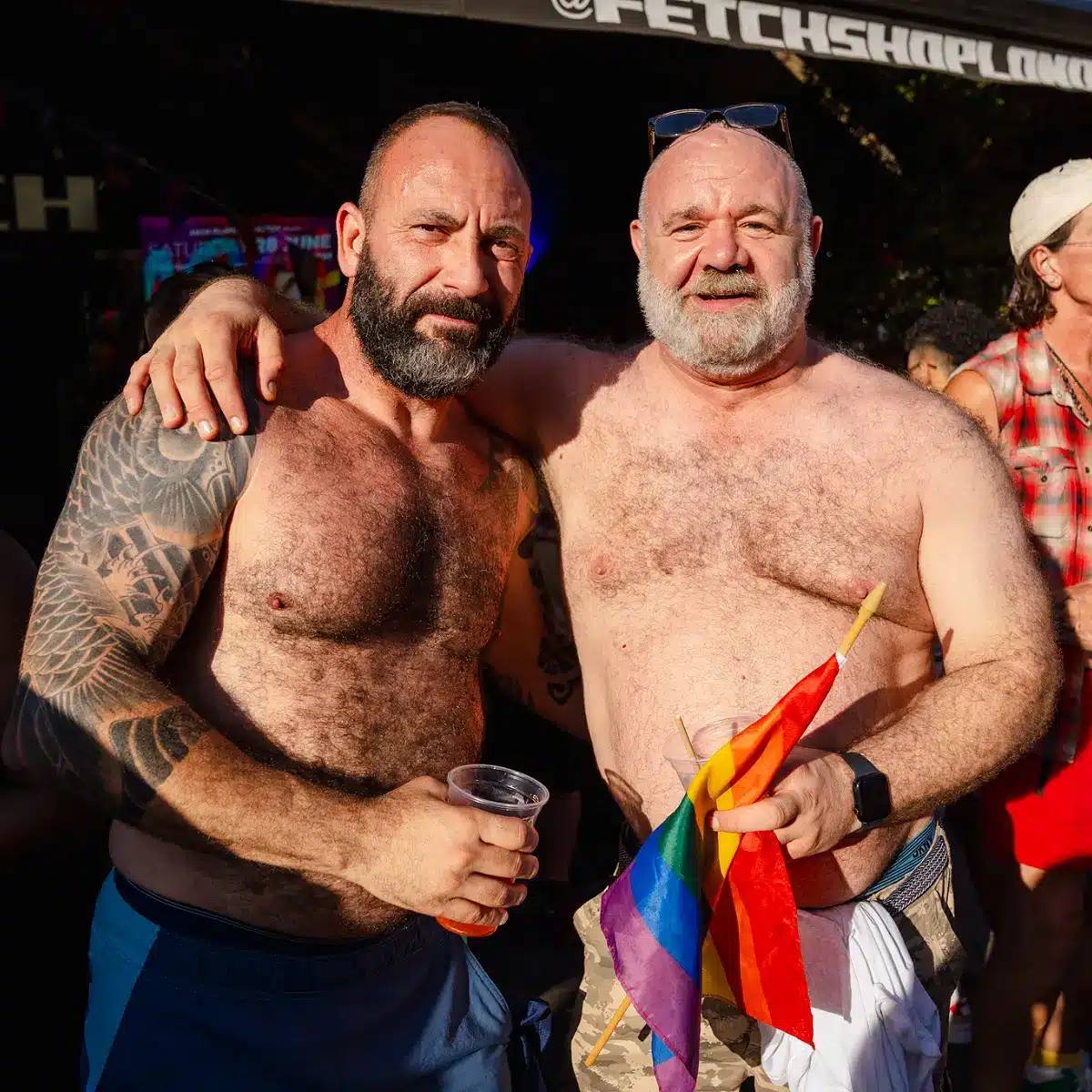 Crowds celebrating Clapham Pride at Arch Clapham street party with drag performers, DJs, dancing and a lively LGBTQ+ atmosphere on Voltaire Road.