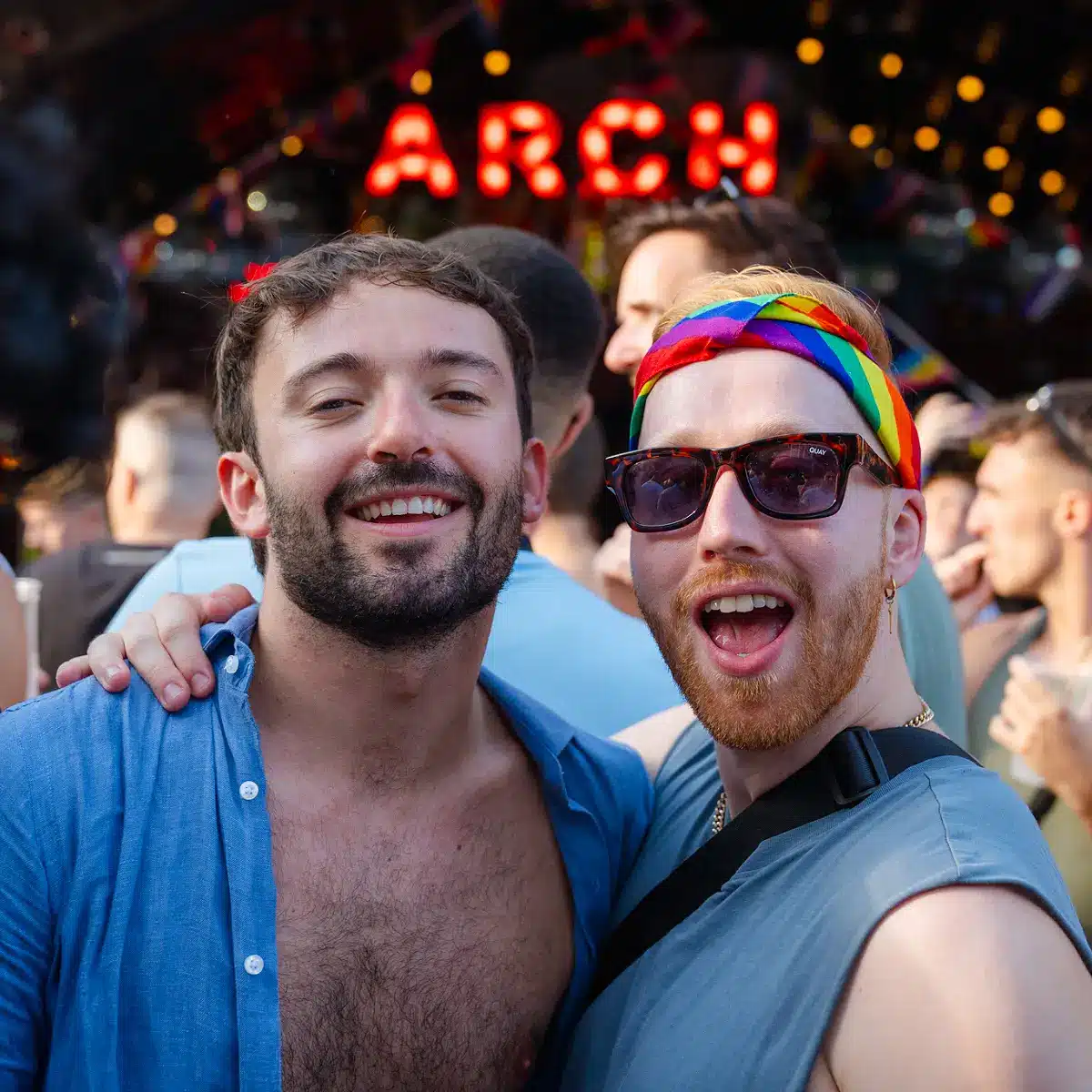 Crowds celebrating Clapham Pride at Arch Clapham street party with drag performers, DJs, dancing and a lively LGBTQ+ atmosphere on Voltaire Road.