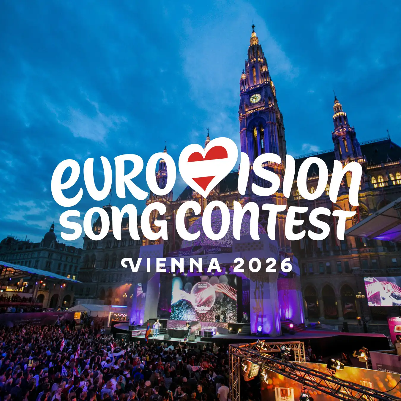 Eurovision 2026 2 Crowd gathered in Vienna city square for Eurovision Song Contest 2026, with illuminated stage and historic building backdrop during live outdoor event.